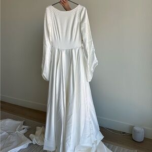 White Tiered Ruffled Wedding Gown with Bishop Sleeves